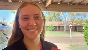 Holly is smiling after getting her driver's licence.