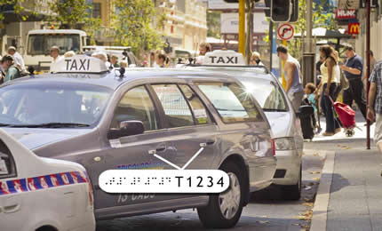 Raised taxi registration numbers must be placed on the exterior passenger doors of the taxi.