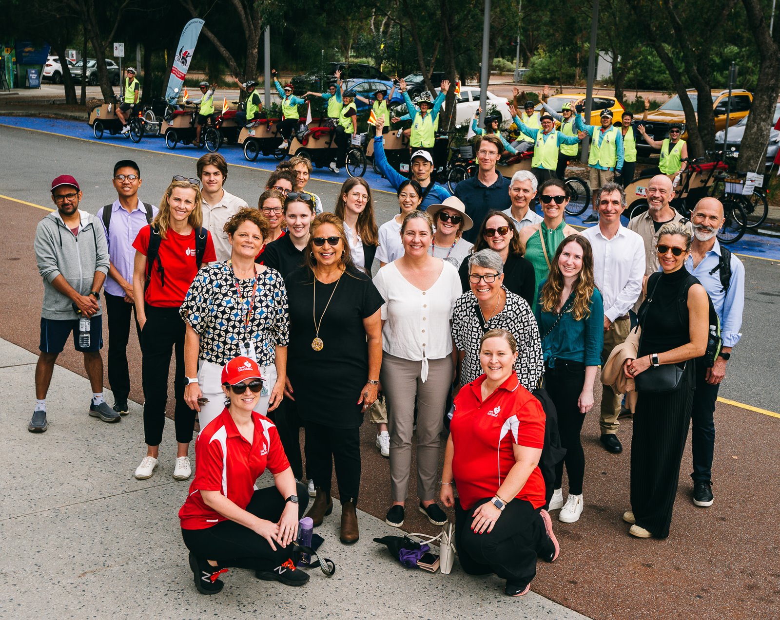 Conference attendees participating in the ‘Walk and Talk the Matagarup, Boorloo’ session, enjoying trishaw rides and hearing from Whadjuk Boodja Traditional Owner Karen Jacobs.