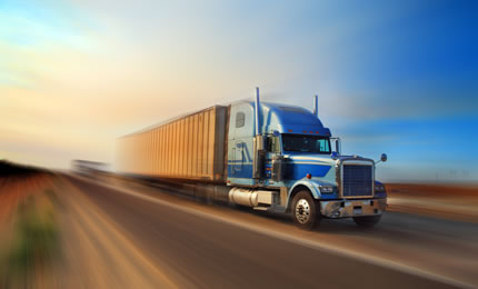 Heavy vehicle travelling on a country road