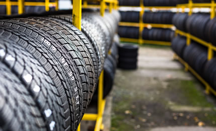 New car tyres sitting in a rack