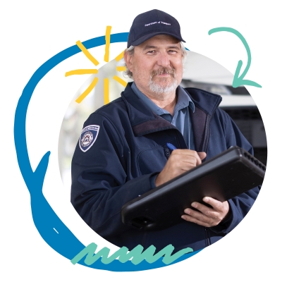 A vehicle inspector standing in front of a car with a clipboard.