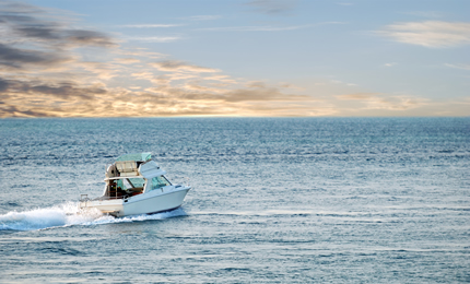 Small cabin cruiser at sea