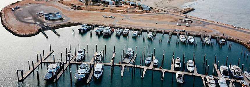 Aerial image of boats pens at Exmouth Boat Harbour