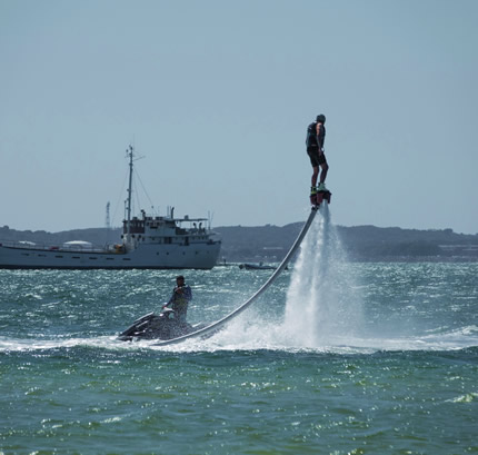 Image of aerial freestyle device attached to a jetski