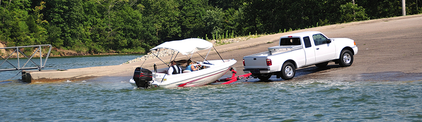 Image of car with boat and trailer