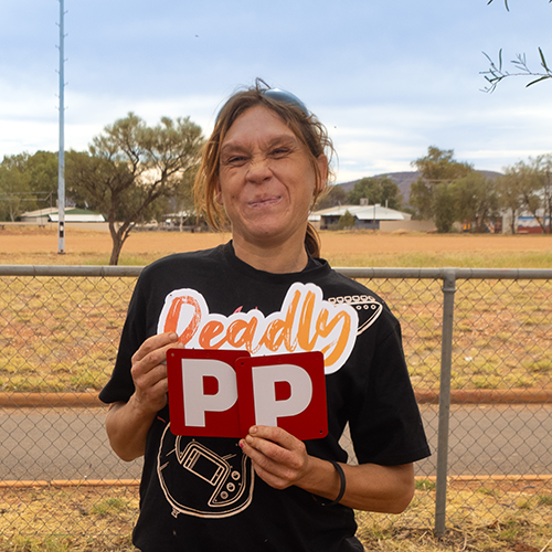 Latoya proudly shows off her P plates after passing her PDA with the Remote and Mobile Services team