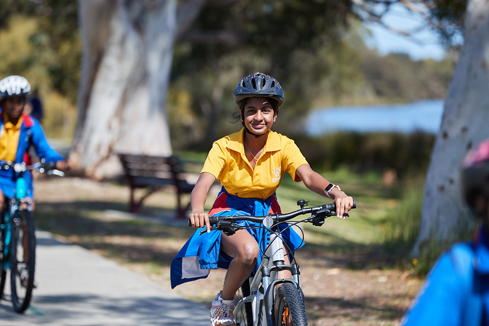 School student riding a bike